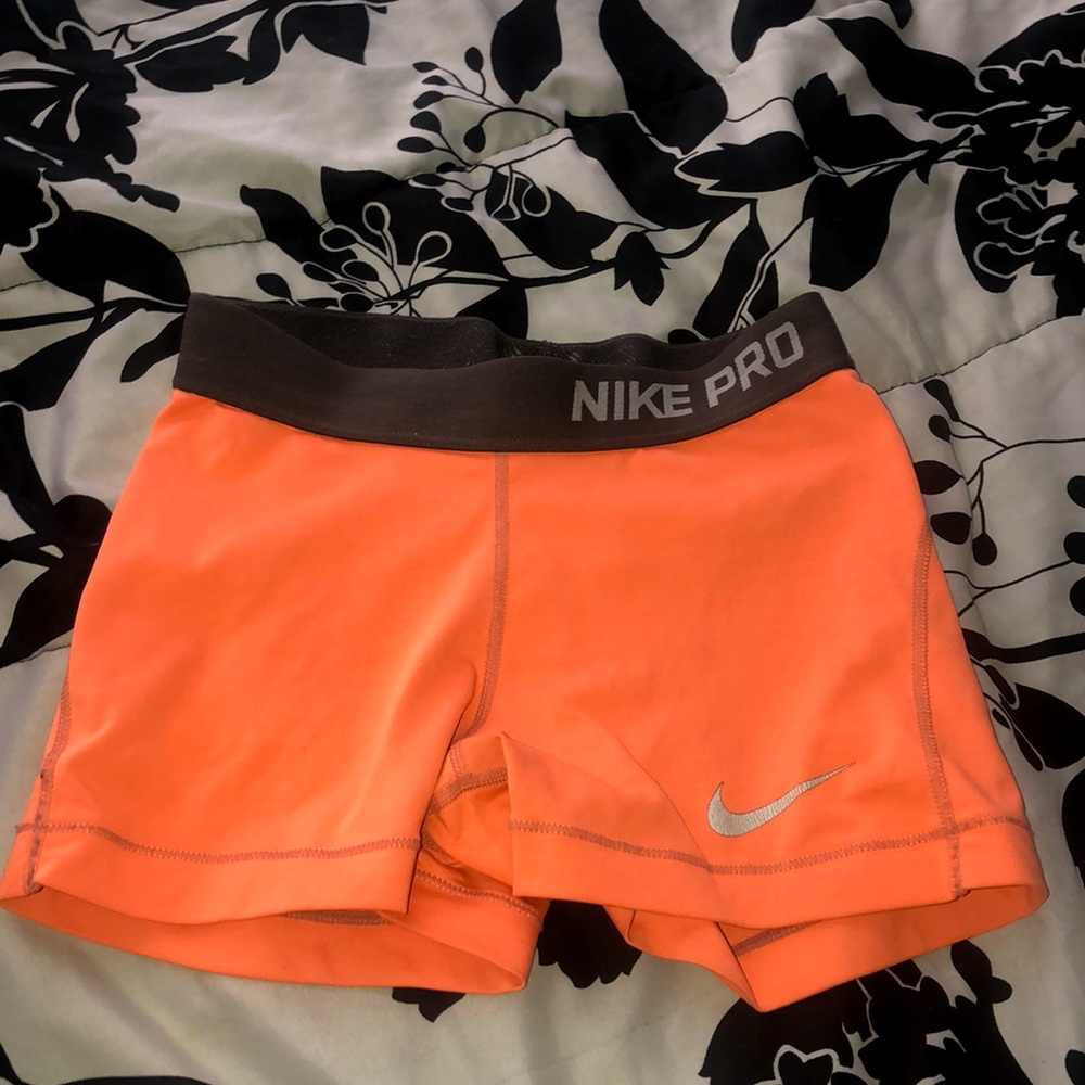 Orange Nike pro shorts